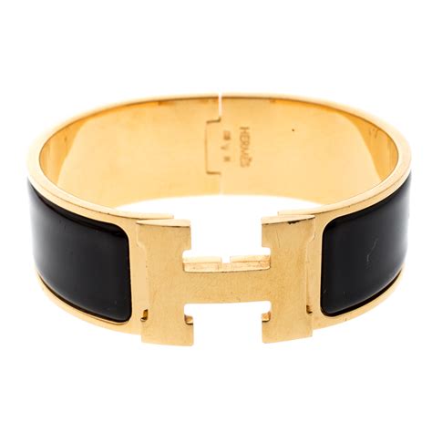 hermes black and gold clic clac bracelet|Hermes clic clac price uk.